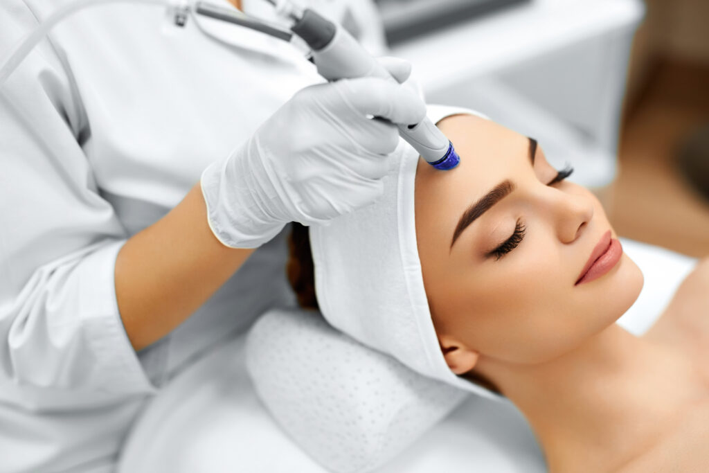 Face,Skin,Care.,Close-up,Of,Woman,Getting,Facial,Hydro,Microdermabrasion